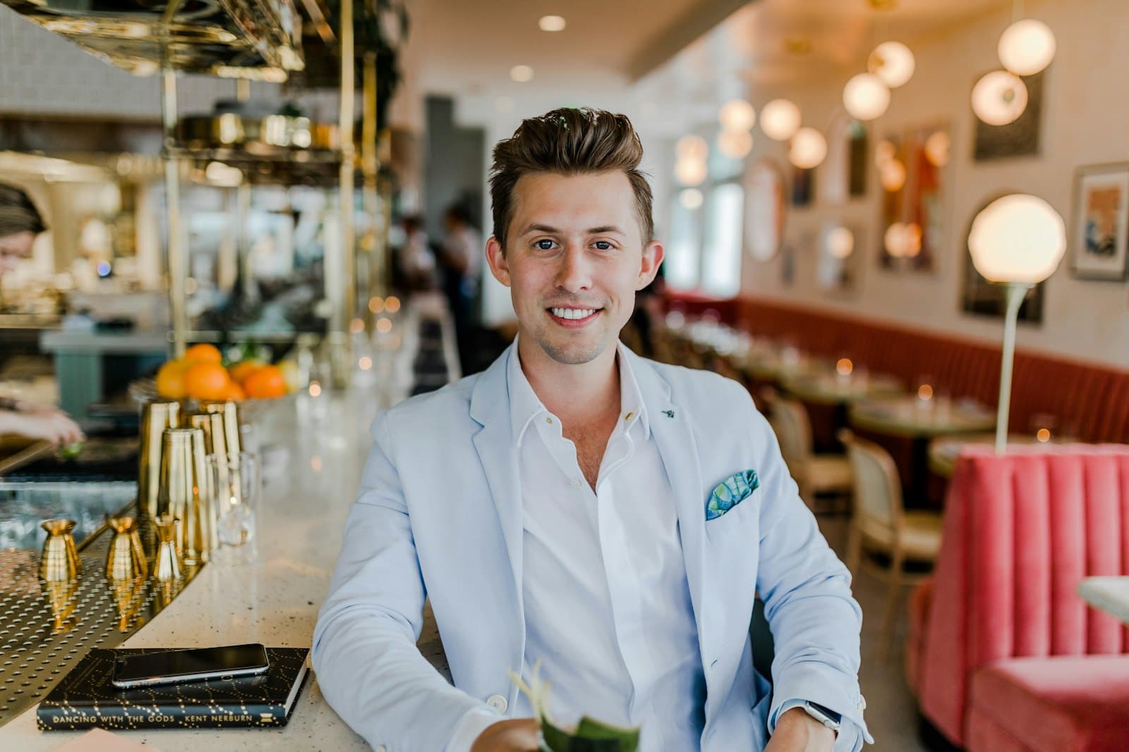 Smiling business owner seated in a restaurant