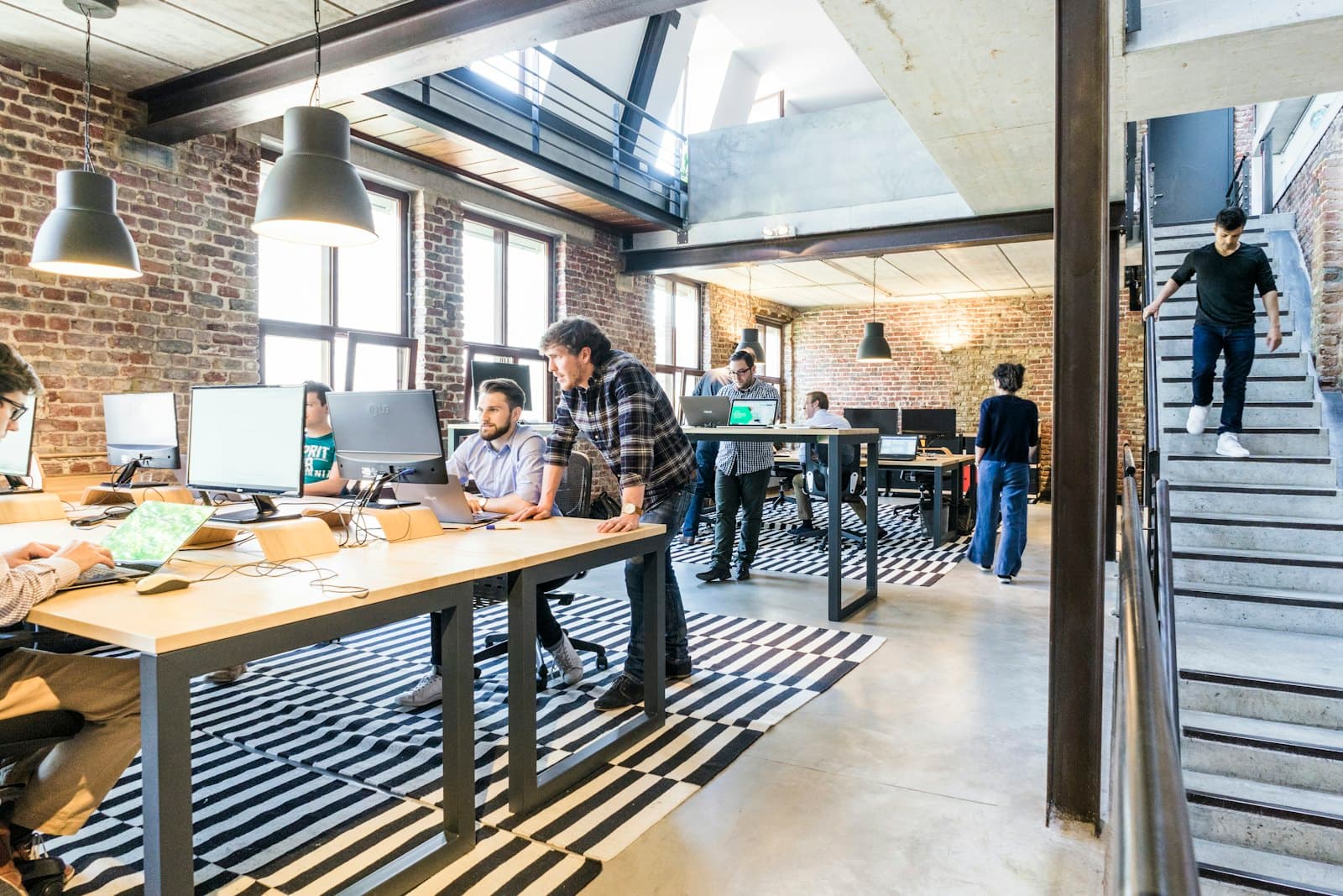 Open studio workspace with desks and plants